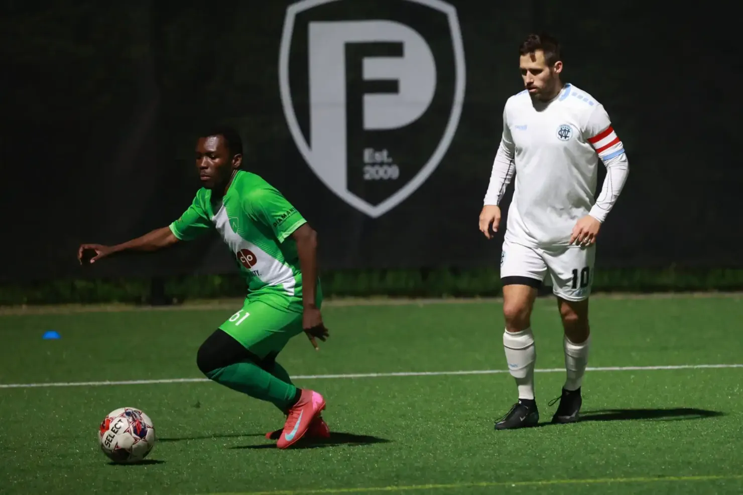 Alloy player carrying the ball upfield